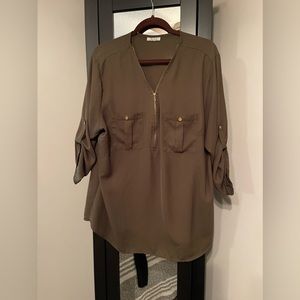 Sheer Blouse, great for formal work attire.2pockets in front and zipper detail.